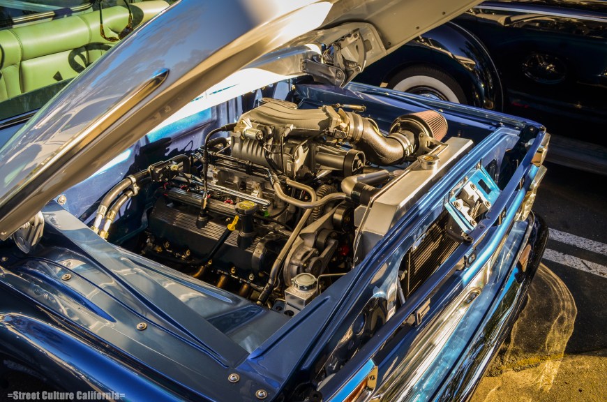 I don't know how the owner was able to fit this huge blown V8 under the hood of this old Ford pickup.
